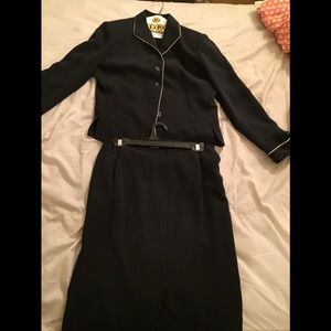 A 2 peice suit with white embroidered ends